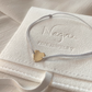 14K Gold Heart Charm Bracelet for Women with grey silver cord made by Negru Jewelry store